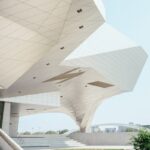 white concrete building under blue sky at daytime